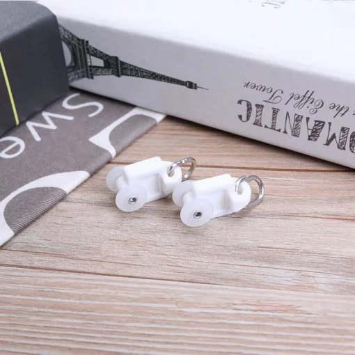 Ролики (бігунки) для електрокарниза